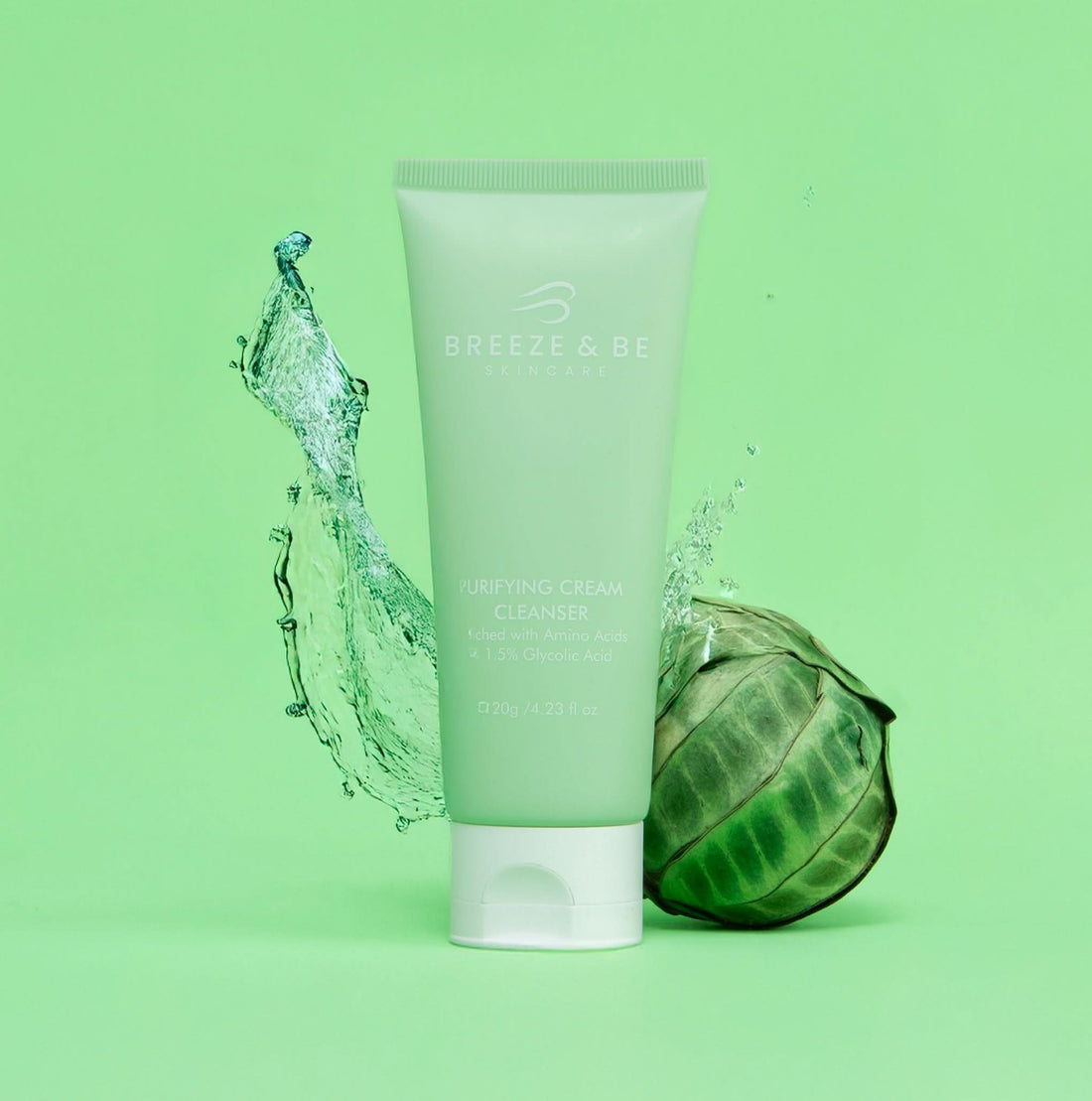 Tube of Breeze &amp; Be cream cleanser with a water droplet and leaf on a green background