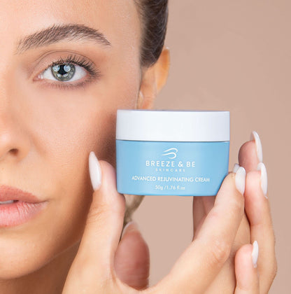 Woman holding a jar of Breeze &amp; Bee skincare cream against a neutral background